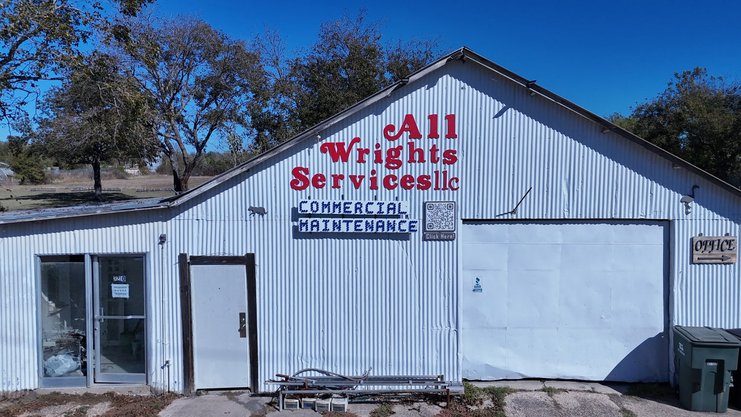 White building with 'All Wrights Services LLC' sign on a clear day