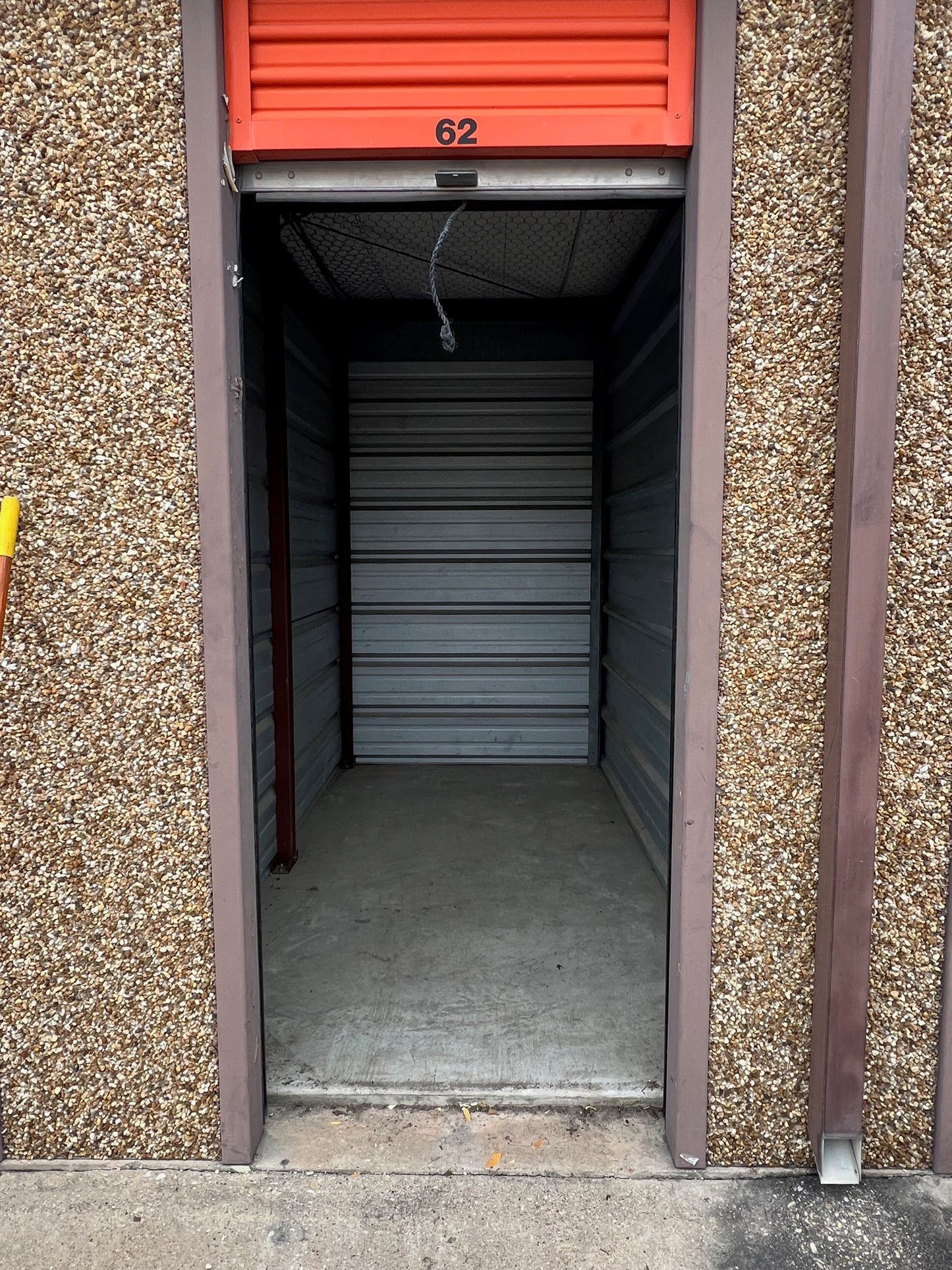 Picture of empty commercial storage unit cleaned out by All Wrights Services llc.