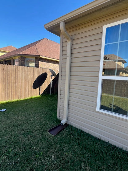 New guttering and down spout install with matching paint to home.