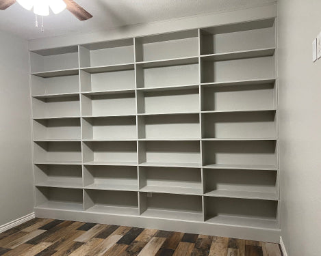 Full picture living book shelf painted grey to match walls