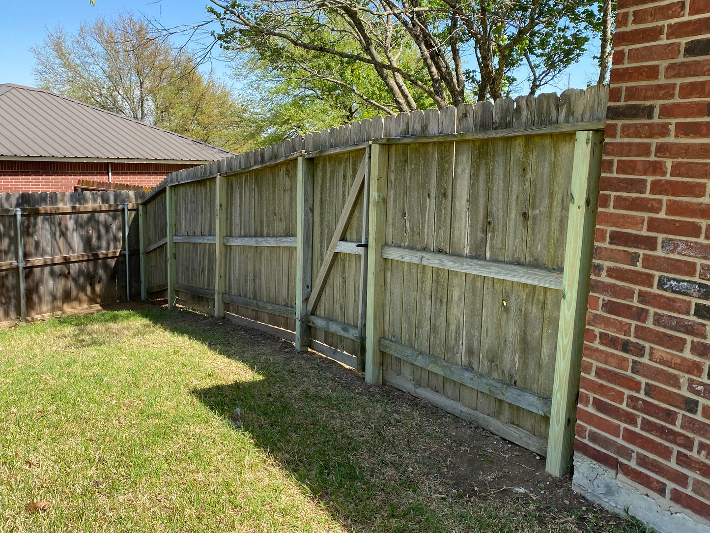 Repaired privacy fence and gate with replaced 4 by 4 post and concrete.